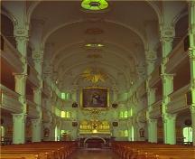 Central view of the interior of the Bon-Pasteur Chapel, 1980.; Parks Canada Agency/ Agence Parcs Canada, 1980.
