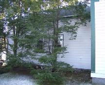 View of rear ell (blocked by trees) Everett Smith House, Barrington Passage, NS, 2007.; Department of Tourism, Heritage and Culture, Province of Nova Scotia 2007