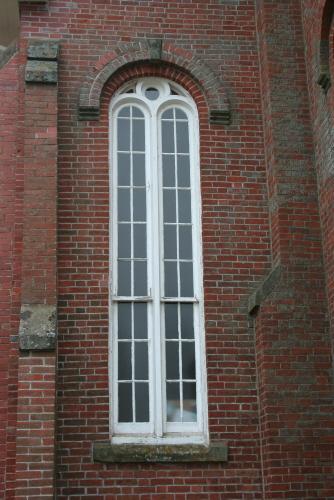 Showing round arch window detail