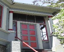 This photograph shows the entrance of the building and shows the columns that support the entrance cornice over the entrance, 2005; City of Saint John
