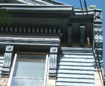 This image shows the wood cornice supported by brackets, 2006.; City of Saint John