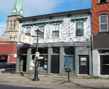 This photograph shows a contextual view of the building on Princess Street, 2005.; City of Saint John