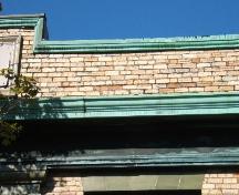 This image provides a view of the brick parapet above the cornice, 2006.; City of Saint John