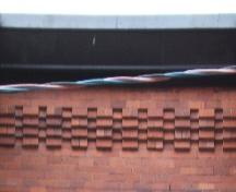 This image provides a view of the cornice ornamented with brick corbel bands, 2005.; City of Saint John