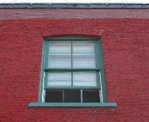 This photograph shows one of the segmented arch windows, 2005.; City of Saint John