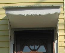 This image provides a view of the entablature over the entrance, 2005.; City of Saint John