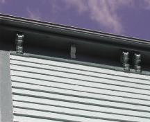 This photograph shows the cornice with brackets, 2005.; City of Saint John