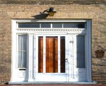 Main Entrance which displays recessed sidelights and a decorated transom, 2002.; Department of Planning, City of Brantford, 2002.