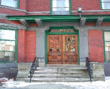 This photograph shows the entrance with large sandstone pilasters, 2005.; City of Saint John