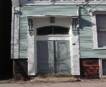 This photograph shows the entrance with bracketed entablature, 2005.; City of Saint John