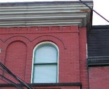 This photograph shows the Roman arch windows and the cornice, 2005.; City of Saint John