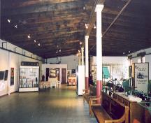 View of the interior of  the warehouse showing the wooden beams and support columns – 2003; OHT, 2003