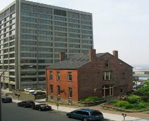 This image shows the two-and-a-half storey building located at 9 Chipman Hill.; Province of New Brunswick