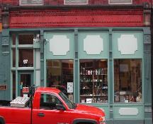 This photograph shows the storefront with cast iron pilasters, 2005.; City of Saint John
