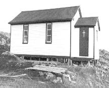 St. Anne's Church on Little Fogo Island; exterior photo showing main entrance, circa 1995.; Heritage Foundation of Newfoundland and Labrador 2004