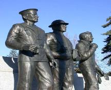 Detailed view of the three male statues located in front of the Brant County War Memorial, 2004.; Department of Planning, City of Brantford, 2004.