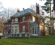 View of the back (west elevation) featuring the singe storey glassed veranda, 2004.; City of Brantford, Department of Planning, 2004.