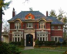 East facing façade featuring front portico, surmounted by a notched parapet, 2004.; City of Brantford, Department of Planning, 2004.