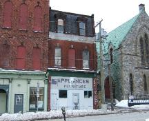 This photograph shows the proximity of this building to the Trinity Anglican Church and Berryman's Hall, 2004; City of Saint John
