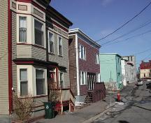This photograph shows the streetscape and illustrates the common characteristic of the simple projecting cornices, 2005; City of Saint John