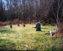 Showing context of cemetery near wooded area; PEI Genealogical Society, 2006