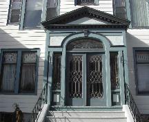 This photograph shows the elaborate entrance with pediment, sidelights and fan window, 2005; City of Saint John