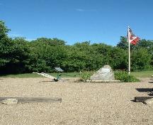 Stone cairn, flag pole and walking plow, 2004.; Government of Saskatchewan, Lisa Dale-Burnett, 2004.