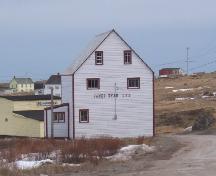 View of left gable end of James Ryan Shop, Elliston, before restoration, circa 2004.; Heritage Foundation of Newfoundland and Labrador, file # M-035-014, Elliston - James Ryan Shop