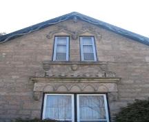 Eight carved stone heads on the front (northeast) gable-end of the Bell O'Donnell House.; Lindsay Benjamin, 2007.
