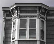 This photograph shows the ornate cornice at the top of one of the bay windows, 2005; City of Saint John