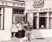 Manager Goodwin and Staff in front of bank, 1974; Photo by S.A. Crawford