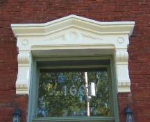 This photograph shows the ornate entablature over the entrance, 2005; City of Saint John
