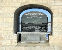Detail view of the plaque, of the Bell Tower of the Ukrainian Catholic Church of St. Michael the Archangel, Tyndall, 2005; Historic Resources Branch, Manitoba Culture, Heritage, Tourism and Sport, 2005