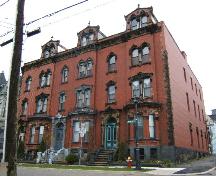 This photograph is a contextual view of the building on Orange Street along with 77 and 79 Orange Street, 2005; City of Saint John