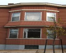 This image provides a view of the two-storey semi-octagonal bay window on the west side of the front façade, 2005; City of Saint John