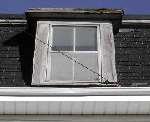 This image provides a view of a dormer above the projected cornice, 2005
; City of Saint John