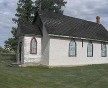 Anglican Church, side elevation showing newer stucco cladding and original siding on vestibule; Fedyk, 2008