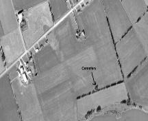 Aerial view shows cemetery located amid trees; Province of PEI, 1974