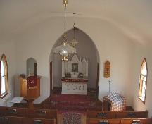 View of altar and raised pulpit from rear loft.; Government of Saskatchewan, Lisa Dale-Burnett, 2004.