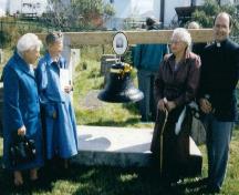 Photo after a ceremony of re-dedication at First Anglican Cemetery, Arnold's Cove, NL, showing the bell erected in memory of Jonathan Boutcher, 1990; Courtesy of Iris Brett, 2008
