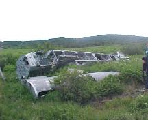 Photo showing plane wreck at the 1942 Plane Crash Site, Conche, NL, 2003; Courtesy of French Shore Historical Society, 2008