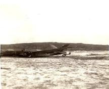 Photo showing the plane at the 1942 Plane Crash Site, Conche, NL in 1942.; Courtesy of French Shore Historical Society, 2008