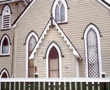 View of the storm porch of Christ Church / Quidi Vidi Church, showing the three-bay façade with central door flanked by pointed arch windows under drip mouldings, 1994.; Parks Canada Agency / Agence Parcs Canada, J. Butterill, 1994.