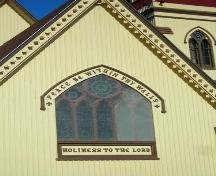 Detail view of the east window and hole-drilled bargeboard, St. James' Anglican Church, Mahone Bay, NS, 2009.; Heritage Division, NS Dept. of Tourism, Culture and Heritage, 2009