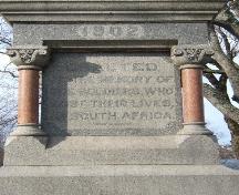 This photograph shows one of four sides of the base of the statue, inscribed "Erected to the memory of the soldiers who lost their lives, in South Africa", 2006 ; City of Saint John