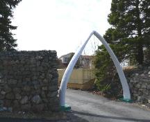 Photo of entrance at Fordheim Property, showing whale bone arch and rock wall, Holyrood, NL, 2008/05/06; L Maynard, HFNL, 2008