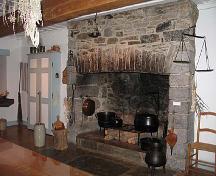 Interior view of Maison Saint-Gabriel, showing one of the large, stone fireplaces, 2005.; Parks Canada Agency / Agence Parcs Canada, N. Clerk, 2005.