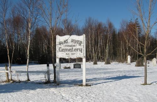 Overview of cemetery with sign