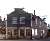 This image shows the boomtown style front façade of the building, 2007; Town of Shippagan