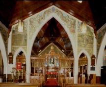 General view of St. Jude's Anglican Church, showing the decorative designs of the chancel.; Parks Canada Agency/ Agence Parcs Canada.